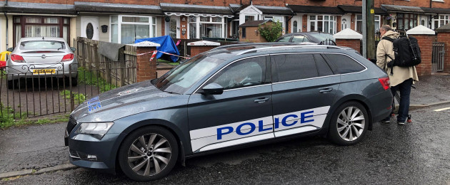 Police at the scene in Brompton Park, Belfast, where a baby died and another young child was critically injured.