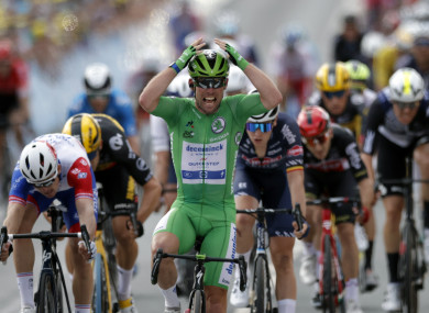 Mark Cavendish reacts after crossing the finish line.