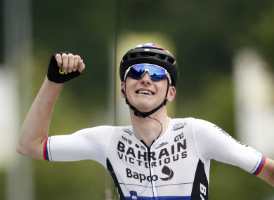 Matej Mohoric celebrates crossing the line.
