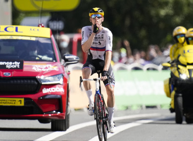 Slovenia's Matej Mohoric gestures to be quiet as he crosses the finish line to win the 19th stage of the Tour de France.