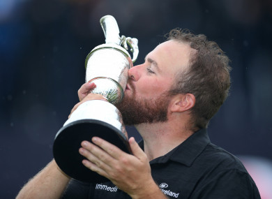 Lowry celebrates with the Claret Jug after winning The Open Championship 2019 at Royal Portrush Golf Club.