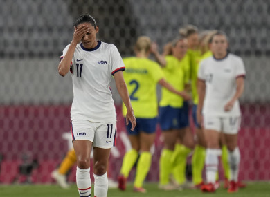 United States' Christen Press reacts as Sweden's players celebrate