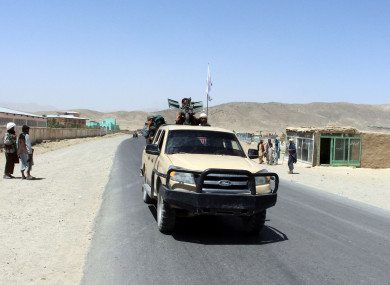 Taliban fighters patrol inside the city of Ghazni, southwest of Kabul, Afghanistan