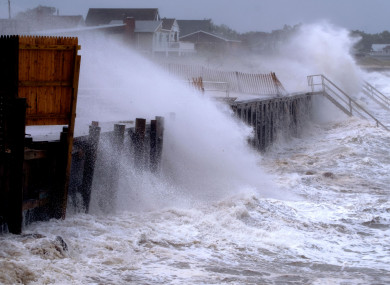 Waves pound a seawall in Montauk, New York as Tropical Storm Henri affects the Atlantic coast.