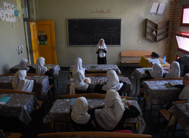 Afghan girls attend a class at a local school in Mazar-i-Sharif, capital of Balkh province, Afghanistan.