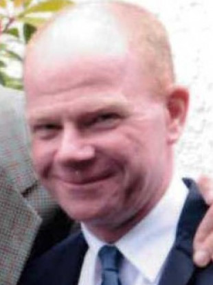 Barry is described as being 5’ 8” in height, of medium build and bald.