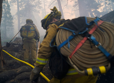 More than 14,600 firefighters were on the lines of 13 active, large wildfires in California