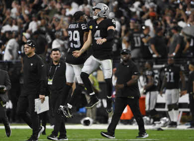Las Vegas Raiders cornerback Casey Hayward (29) and quarterback Derek Carr (4) celebrate after defeating the Baltimore Ravens during overtime.