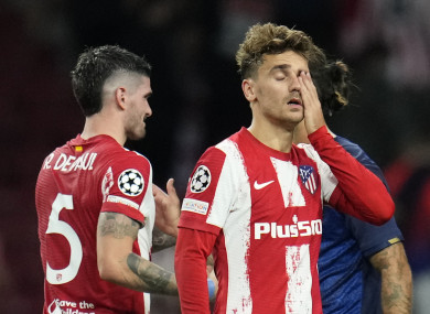 Atletico Madrid's Antoine Griezmann wipes his eyes at the end of the Champions League Group B match.