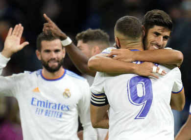Karim Benzema congratulates Marco Asensio after Real Madrid's fourth goal.
