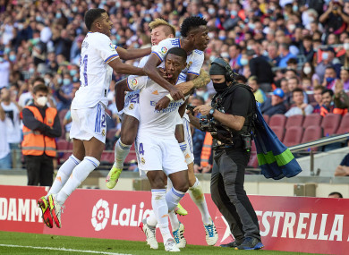 Real Madrid players celebrate after David Alaba's goal.