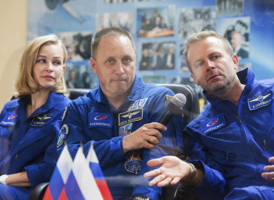 Actress Yulia Peresild, director Klim Shipenko, right, and cosmonaut Anton Shkaplerov