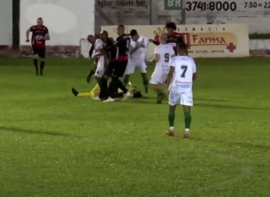 Referee Rodrigo Crivellaro lying on the ground after the attack.