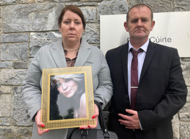 Melanie Sheehan and Barry Cleary, parents of Eve Cleary, holding a framed photograph of their daughter, outside Limerick Coroners Court.