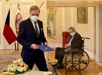 Czech President Milos Zeman (right), in a transparent cube because he tested positive for Covid-19, appoints Petr Fiala as prime minister