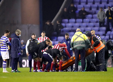 Sheffield United's John Fleck is placed on a stretcher during the Sky Bet Championship match at the Madejski Stadium.