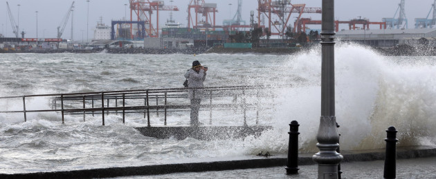A photographer takes pictures on the seafront in Clontarf, Dublin, today.
