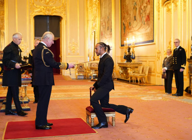 Lewis Hamilton is made a Knight Bachelor by the Prince of Wales at Windsor Castle.