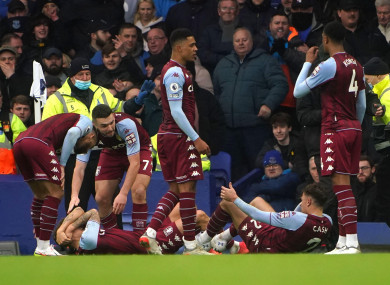 Aston Villa's Lucas Digne and Matty Cash react to being hit by a bottle.