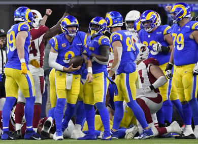 LA Rams congratulate Matthew Stafford after he scores a touchdown.