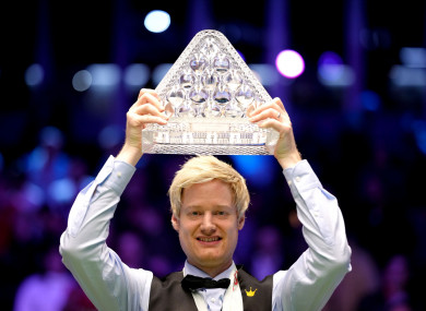Neil Robertson celebrates with the Paul Hunter trophy after his 10-4 Masters victory over Barry Hawkins.