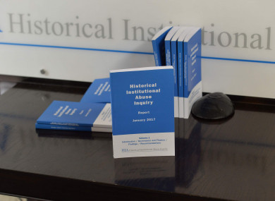 Copies of the Historical Institutional Abuse inquiry report on show during the press conference in Belfast on its publication