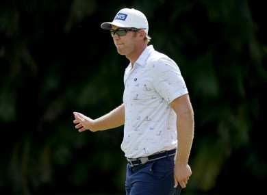 Seamus Power waves after making birdie on the first green during the final round of the Sony Open.