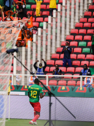Toko Ekambi celebrates after scoring.