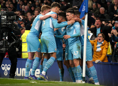 Manchester City's Phil Foden (right) celebrates scoring.