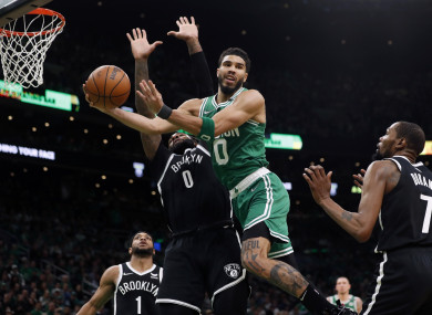 Boston Celtics' Jayson Tatum passes off during Game 2.