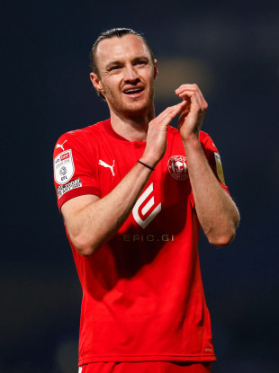 Wigan Athletic's Will Keane celebrates at full time.