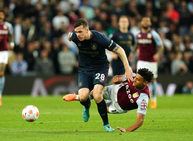 Burnley's Kevin Long and Aston Villa's Ollie Watkins battle for the ball.