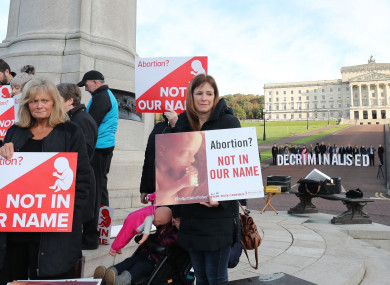 Anti-abortion and pro-choice activists take part in rival demonstrations outside Stormont.