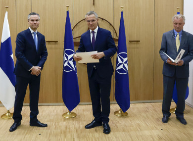 Nato Secretary General Jens Stoltenberg receives requests for membership from Finland's Ambassador to Nato Klaus Korhonen and Sweden's Ambassador to Nato Axel Wernhoff.