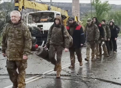 Ukrainian servicemen leave the Azovstal steel plant in Mariupol