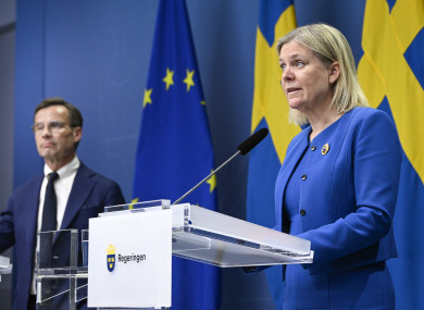 Sweden's Prime Minister Magdalena Andersson and the Moderate Party's leader Ulf Kristersson give a news conference in Stockholm.
