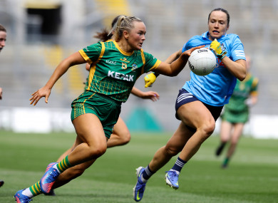 Meath star Vikki Wall in full flight against Kate McDaid of Dublin in Saturday's Leinster final at Croke Park.