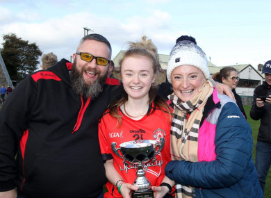 Leah Scholes, with her mother Cathy and dad John, celebrating their championship final win in October 2019.
