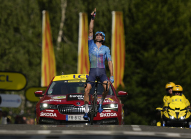 Canada's Hugo Houle points skywards and dedicates his victory to his brother Pierrick who was killed by a drunk driver almost 10 years ago,