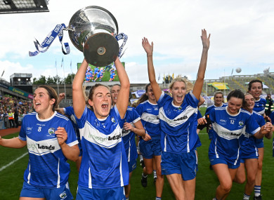 Laois captain Aimee Kelly celebrates with the Mary Quinn Memorial Cup.