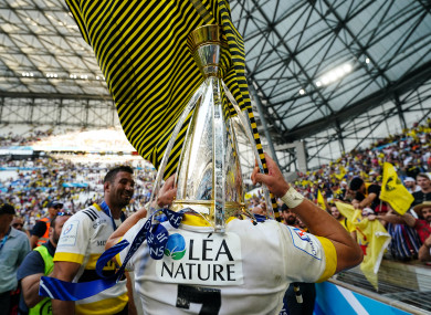 La Rochelle's Matthias Haddad celebrates with the Champions Cup trophy.