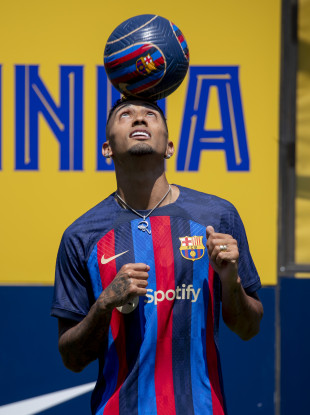 Brazilian forward Raphinha controls the ball during his official presentation after signing for FC Barcelona.