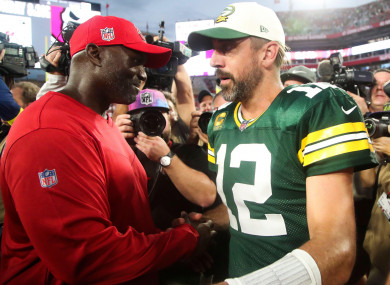 Tampa Bay Buccaneers head coach Todd Bowles greets Green Bay Packers quarterback Aaron Rodgers.