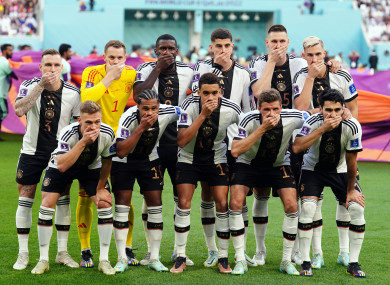 Germany players cover their mouths in a show of protest.