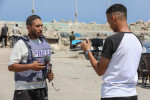 Journalists attempt to cover the news in Gaza City during an internet and phone service outage last month.