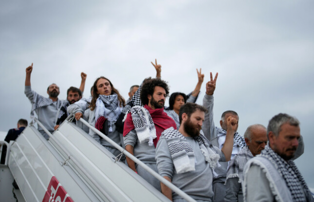 Irish flotilla activists deported from Israel land at Dublin Airport to hundreds of supporters