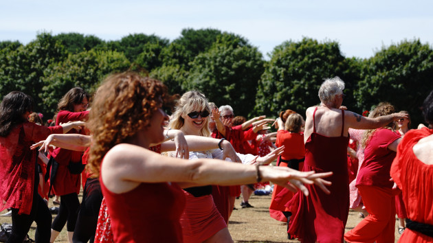 Hundreds gather in a Dublin park dressed as Kate Bush to perform Wuthering Heights