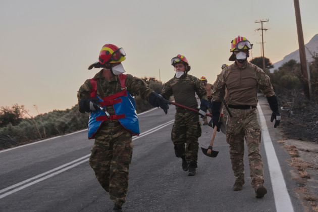Wildfire rages on Crete as strong winds and dense smoke hamper firefighting operations