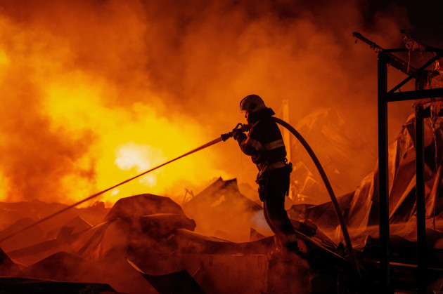 Overnight Russian strikes kill at least 15 people in Kyiv and surrounding regions Kyivs military administration said the missile and drone barrage slammed into residential buildings and several warehouses.